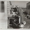 Mrs. C.D. Grant and neighbor making pork sausage. Penderlea Farms, North Carolina