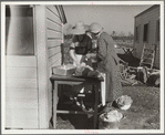 Mrs. C.D. Grant and neighbor making pork sausage. Penderlea Farms, North Carolina