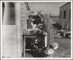 Mrs. C.D. Grant and neighbor making pork sausage. Penderlea Farms, North Carolina
