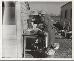 Mrs. C.D. Grant and neighbor making pork sausage. Penderlea Farms, North Carolina