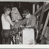 Chopping beans in the canning plant at Dania, Florida. Youthful workers are allowed to use dangerous machinery without safeguards