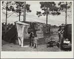 The temporary home of a migrant citrus worker and his family. Now camped near the packing plant of Winterhaven, Florida. The family is originally from Tennessee