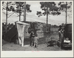 The temporary home of a migrant citrus worker and his family. Now camped near the packing plant of Winterhaven, Florida. The family is originally from Tennessee