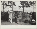 The temporary home of a migrant citrus worker and his family. Now camped near the packing plant of Winterhaven, Florida. The family is originally from Tennessee