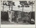 The temporary home of a migrant citrus worker and his family. Now camped near the packing plant of Winterhaven, Florida. The family is originally from Tennessee