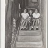 Children of migrant citrus worker who lives in a rundown apartment house. The sink at the head of the stairs is the only running water in the house. Winterhaven, Florida