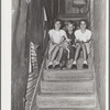 Children of migrant citrus worker who lives in a rundown apartment house. The sink at the head of the stairs is the only running water in the house. Winterhaven, Florida