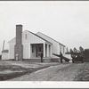 Mr. William Howard supervises the men moving his household goods into a new house at Gardendale, Alabama