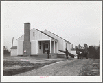 Mr. William Howard supervises the men moving his household goods into a new house at Gardendale, Alabama