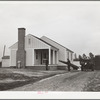 Mr. William Howard supervises the men moving his household goods into a new house at Gardendale, Alabama
