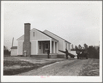 Mr. William Howard supervises the men moving his household goods into a new house at Gardendale, Alabama