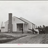 Mr. William Howard supervises the men moving his household goods into a new house at Gardendale, Alabama