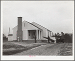 Mr. William Howard supervises the men moving his household goods into a new house at Gardendale, Alabama