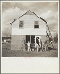 Painting one of the new houses for industrial and white collar workers of Birmingham. Slagheap Village [i.e. Cahaba Village], Alabama