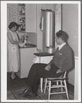 Mr. and Mrs. Andey Smith in the kitchen of their new home. Greenwood, [Jefferson County?,] Alabama