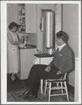Mr. and Mrs. Andey Smith in the kitchen of their new home. Greenwood, [Jefferson County?,] Alabama