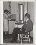 Mr. and Mrs. Andey Smith in the kitchen of their new home. Greenwood, [Jefferson County?,] Alabama