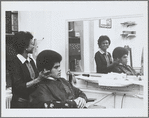 Actor Jim Kelly in a barbershop