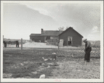 Type of house and farmer to be removed from land development area. Pennington County, South Dakota