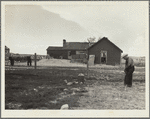 Type of house and farmer to be removed from land development area. Pennington County, South Dakota