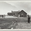 Type of house and farmer to be removed from land development area. Pennington County, South Dakota