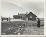 Type of house and farmer to be removed from land development area. Pennington County, South Dakota