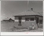 Old sod homestead in background. New house in foreground. Pennington County, South Dakota