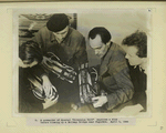 A commander of Special "Diversion Unit" examines a mine before blowing up a Railway Bridge near Pogorzne. April 5, 1944.