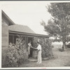 Doctor Tugwell visiting rehabilitation client's home. South Dakota