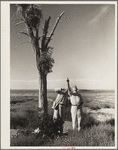 Dr. Tugwell and Chairman Cooke of the drought committee look at a nest of barbed wire in Texas dust bowl. President's report
