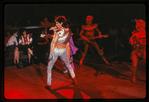 Chippendales dancers on stage [dancer with microphone, back to camera] in the production For Ladies Only