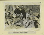 Wounded soldiers of the Polish Home Army taken prisoner by the Germans during the battle of Warsaw.