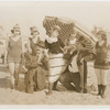 Publicity photograph of Phil Dunham, Alice Howell, and Frank J. Coleman with other Reelcraft Comedy Troupe players in bathing suits on the beach in Hollywood, California during the production of the motion picture Good Night, Nurse
