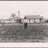 When unemployed, migrants work in labor home gardens. Tulare migrant camp. Visalia, California