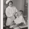 Child being treated in health clinic. Tulare migrant camp. Visalia, California