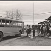 Migrant high school students arriving home from school. Tulare migrant camp. Visalia, California