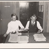 Putting out newspaper. Tulare migrant camp. Visalia, California