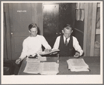 Putting out newspaper. Tulare migrant camp. Visalia, California
