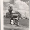 Men in front bulletin board. Tulare migrant camp. Visalia, California