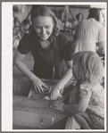 Woman washing clothes. Tulare migrant camp. Visalia, California