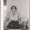 Woman washing clothes. Tulare migrant camp. Visalia, California