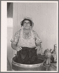 Woman washing clothes. Tulare migrant camp. Visalia, California