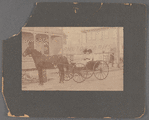 Portrait of two women in horse-drawn carriage