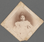 Portrait of a young woman in white with jeweled hair pin
