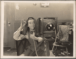 Edward Everett Horton behind the camera in the motion picture No Publicity