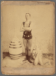 Publicity photograph of juggler Gus Hill with Indian clubs