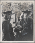 Reverend John H. Johnson (center) meeting with two officers of the New York Police Department outside of St. Martin's Episcopal Church in Harlem, New York