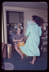 Carmen Alvarez [right] and unidentified other backstage during the stage production Lil' Abner