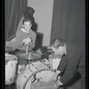 Rich seated at drums with unidentified man