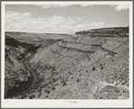 The Deschutes River, like many of the other rivers in the arid portion of central Oregon, is at the bottom of a steep canyon. Stock trails have been built by Resettlement Administration workers to make the water available to cattle